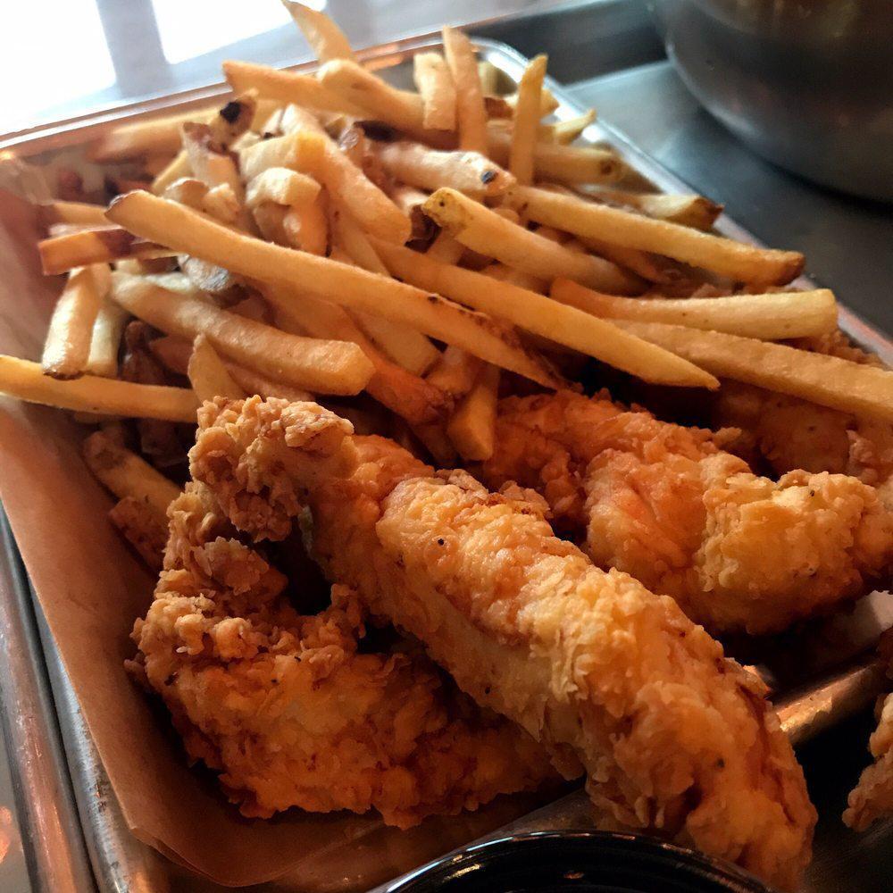 Chicken Strips · Tender chicken breast battered and fried to a golden brown. Served with pub chips and your choice of sauce on the side.