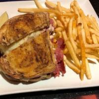 Reuben Sandwich · The perfect blend of thinly sliced corned beef, Swiss cheese, sauerkraut and 1000 Island dre...