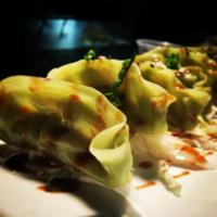 Veggie Pot Stickers · Veggue dumplings with spicy soy sauce 
