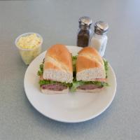 NY Strip Steak Sandwich · Thin slices of steak (medium) on a hoagie roll with lettuce, tomato and house spread.