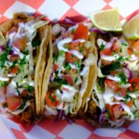 BBQ Jerk'd Street Tacos · Three savory a la carte tacos filled with BBQ shreds with some HEAT topped with cabbage, pic...