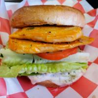 Grilled Buffalo Chk'n Sandwich · Grilled chk'n tossed in buffalo sauce and served up with lettuce, tomato, pickles and our ho...