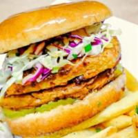 Nashville Hot Chk'n Sandwich · Battered and fried chk'n breast, covered in chili oil with pickles, a spicy mayo and topped ...