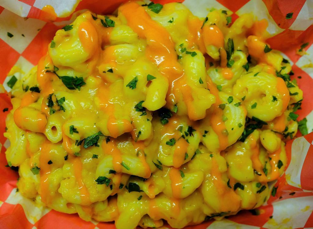 Side Buffalo Mac · A large portion of cavatappi pasta folded into our creamy house-made cheez sauce and drizzled with buffalo sauce!