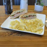 Copper Club · Turkey, ham, bacon, swiss cheese and arugula on telera bread. Served with a side of apple ci...