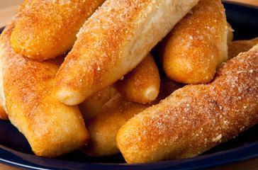 Breadsticks · 6 breadsticks golden and fluffy, coated in garlic butter, and Parmesan served with ranch. Vegetarian.