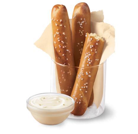Dairy Queen Bakes Pretzel Sticks with Zesty Queso · Soft pretzel sticks, served hot from the oven, topped with salt and served with warm zesty queso dipping sauce.