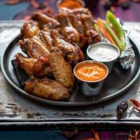 12 Pcs  All Natural Wings · All natural (no hormones or antibiotics)  chicken wings cooked to perfection. Choose your fa...