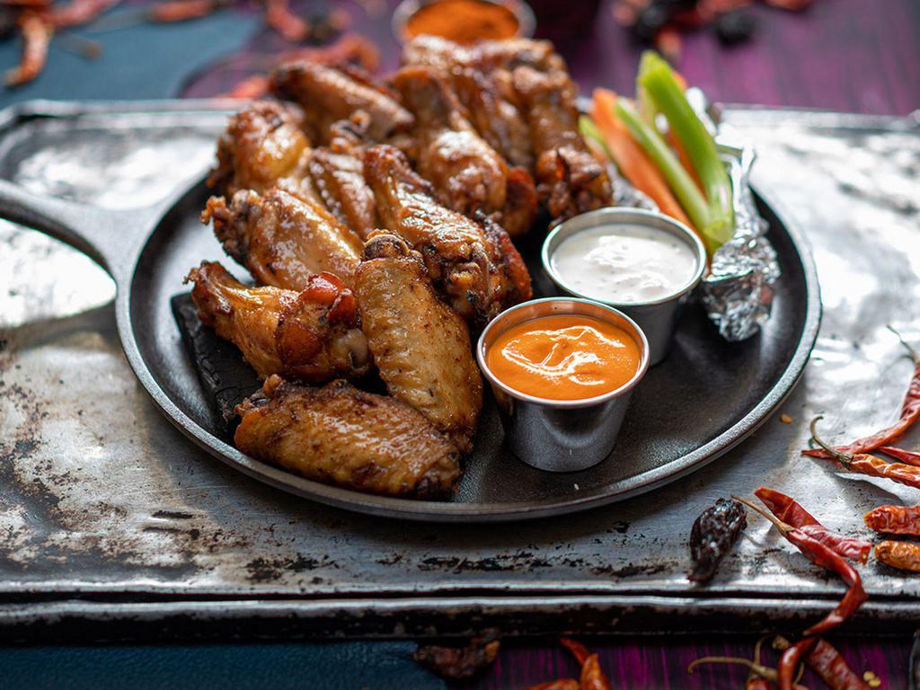 12 Pcs  All Natural Wings · All natural (no hormones or antibiotics)  chicken wings cooked to perfection. Choose your favorite flavor and dipping sauce.