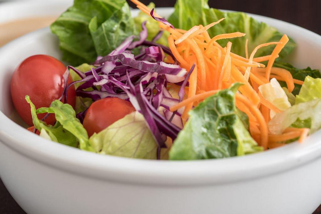 HOUSE SALAD · Crisp greens, red cabbage, carrots and grape tomatoes in a tangy ginger dressing