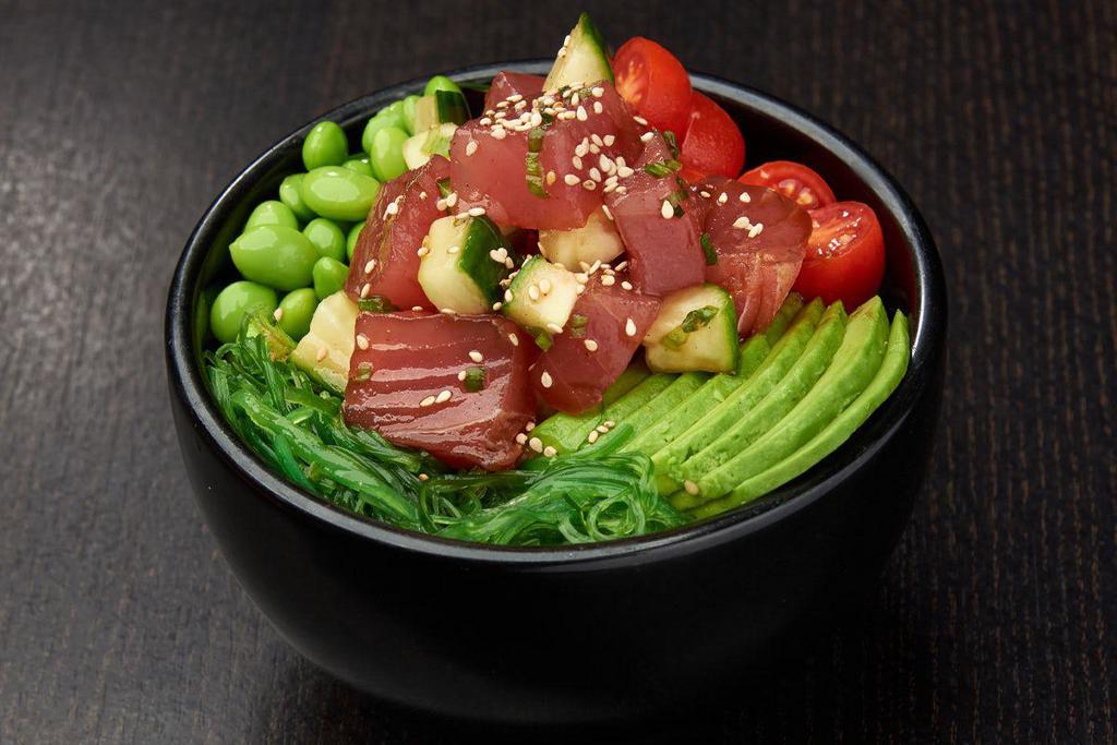 SPICY TUNA BOWL*  · Ahi tuna, cucumber and green onions mixed in poke sauce; served with grape tomatoes, avocados, edamame and seaweed salad; topped with sesame seeds.