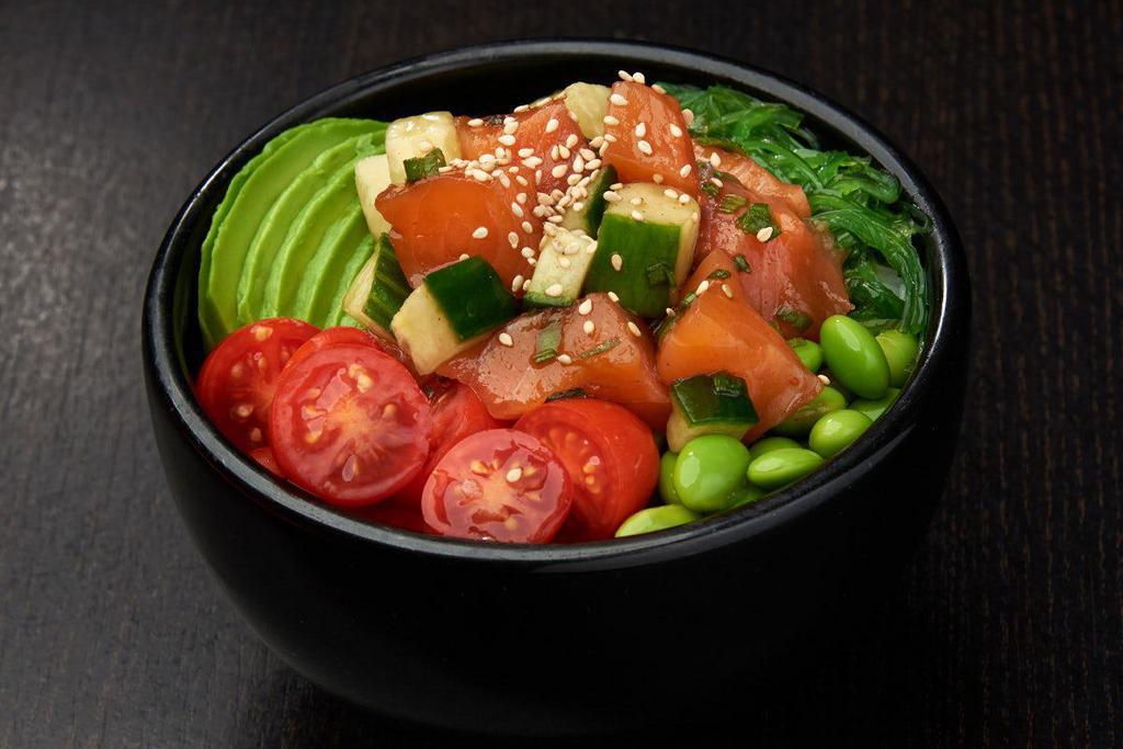 SPICY SALMON BOWL*  · Salmon, cucumber and green onions mixed with poke sauce; served with grape tomatoes and avocados, edamame and seaweed salad; topped with sesame seeds.