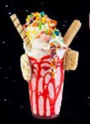 Unicorn Shake · Vanilla coated rim with rainbow sprinkles, rainbow marshmallow, topped with strawberry choco...