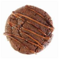 Nutella Stuffed Cookie · Nutella infused cookie dough, stuffed to perfection with Nutella, and topped with Nutella dr...