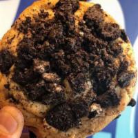 Vegan Cookie and Cream Cookie · Vegan cookie dough, mixed with vegan chocolate chips, stuffed with an oreo, and topped with ...