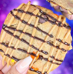 Nutter Butter Lover  · Signature brown sugar cookie dough mixed with crushed Reese's PB cups, Reese's pieces candy, topped with creamy peanut butter and Hershey's chocolate. 