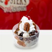 Turtle Sundae · 2 scoops of vanilla ice cream, hot fudge, caramel, crushed pecans, whipped cream and a cherry!