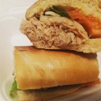 Roast Pork Sandwich - Fri & Sat Only · Sandwich de Pernil con lechuga y tomates. Vie y Sab solamente