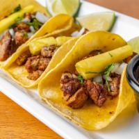 TACOS AL PASTOR · (order of 3) Pork marinated in our delicious Pastor,
served in artisan corn tortilla accompa...
