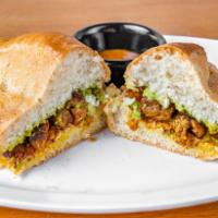 TORTA DE PASTOR · Bolillo bread, spread with guacamole, al pastor meat, onion,
cilantro and mozzarella cheese...