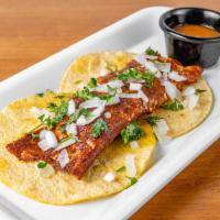 COSTRA DE QUESO · Grilled cheese stuffed with meat al pastor,
served in a corn tortilla with onion and cilantro