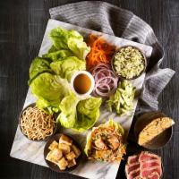 Chicken Lettuce Wraps · Roll your own lettuce wraps with grilled chicken, cilantro lime rice, red onions, cucumbers,...