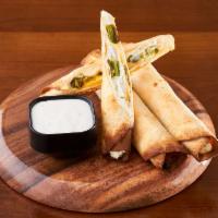 Fuego Rolls · Roasted long hot peppers folded in our three cheese blend in a crispy tortilla shell. Served...