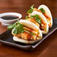 Soft Bao Buns · Filled with fresh carrots, cucumbers, cilantro and sweet chili sauce. Served with your choic...