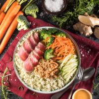 Ginger Tuna Bowl · Seared Ahi Tuna, sliced carrots, fresh cucumber, quinoa and broccoli atop a bowl of our cila...