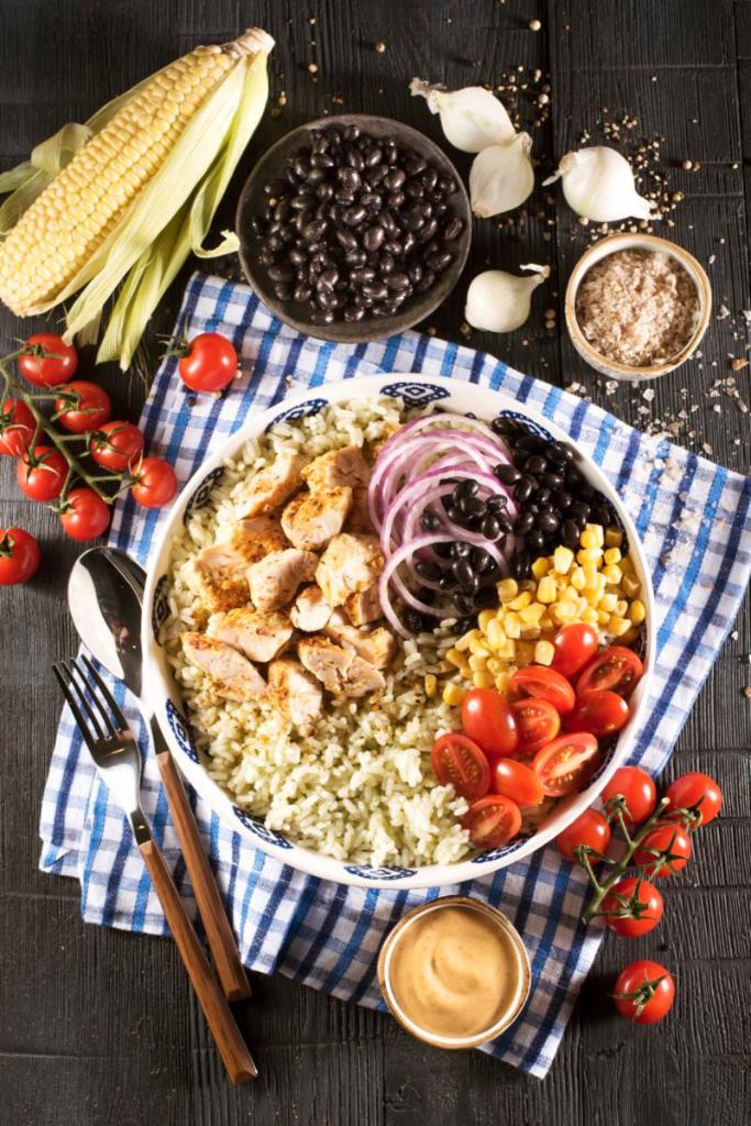 Chicken Burrito Bowl · Southwest grilled chicken, cilantro lime rice, black beans, corn, red onions and cherry tomatoes. Served with chipotle ranch dressing.