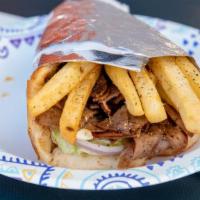 Lamb/Beef Gyro Pita · Lamb and beef gyro sliced off the rotisserie