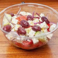 Xoriatiki Salad (Greek Village Salad) · Vine tomato, cucumber, red onion, feta cheese,kalamata olives, topped with extra virgin oil ...