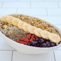 Deluxe Acai Bowl · Our traditional acai, bowl topped with banana, granola, chia seeds, hemp seeds, goji berries...