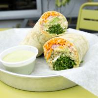 Vegan Wrap · kale, quinoa, cabbage, carrots, pickled red onions, avocado and hummus wrapped in a spinach ...