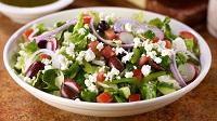 Greek Salad · Crisp romaine hearts loaded with feta cheese, grape tomato, red onion, cucumber, Kalamata ol...