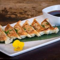 Gyoza (potstickers) · Pan-fried pork dumplings served with a spicy, sweet soy sauce. (6pcs)