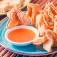 Crab Rangoon · Crispy pastry shell stuffed with imitation crab, celery and cream cheese, deep-fried and ser...