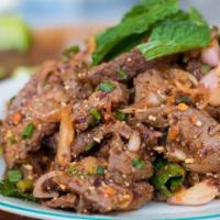 Nam Tok ( Thai Beef salad ) · Beef tenderloin with greenleaf lettuce, green onion, baby spinach, tomatoes, cucumbers, cila...