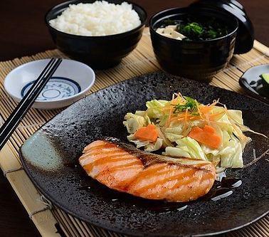 Salmon Teriyaki · Grilled salmon in a seasoned teriyaki sauce, served with jasmine rice and a mixed-green salad. 