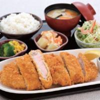 Tonkatsu · Marinated pork coated in bread crumbs, deep-fried and drizzled with homemade katsu sauce. Se...