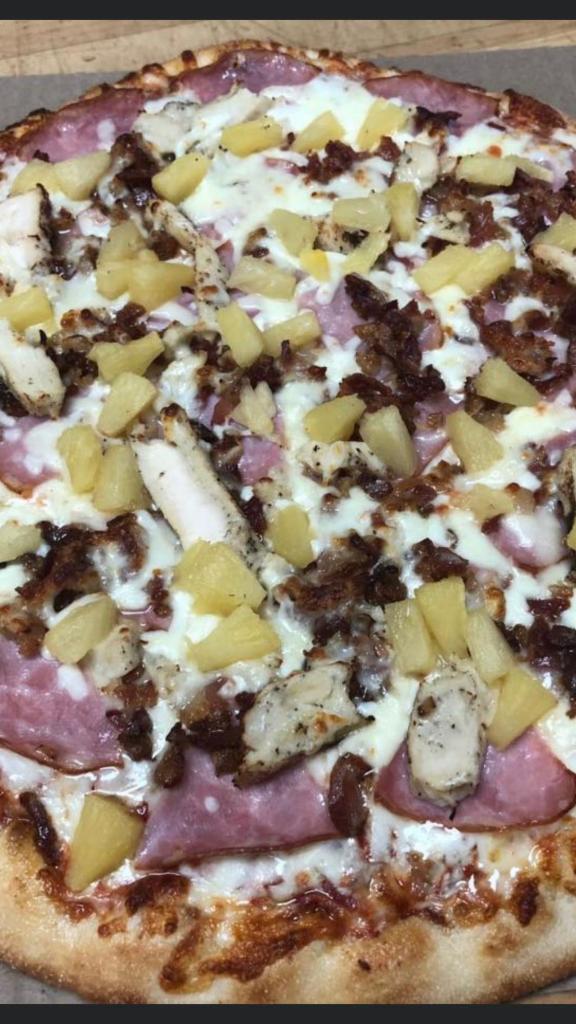 Hawaiian Chicken Pizza · Ham, grilled chicken, bacon, pineapple, our original sauce and signature three cheeses.