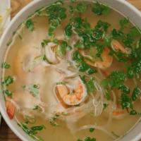 N9. Shrimp Pho · Served with peeled shrimp, rice noodles, chicken broth, white onions, green onions, pepper a...