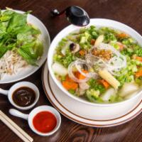 N10. Veggie Pho · Served with carrots, young corn, broccoli, mushroom, tofu, radish and chayote, rice noodles,...