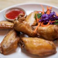 Chicken Wings · Four pieces of deep fried chicken wings.