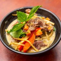 Green Curry · Spicy. green chili paste, bell peppers, mushrooms, eggplant bamboo shoots and basil leave.
