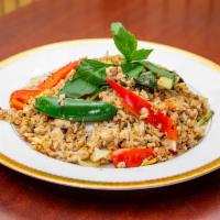 Basil Fried Rice · Spicy. fried rice with egg, garlic, chili, onion, bell pepper, and Thai basil leaves.