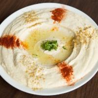Hummus · Homemade Hummus. Comes with two Arabic Pita