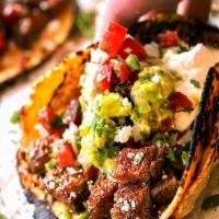 Beef Taco · TACO BLANCO Angus beef tacos are cooked over mesquite flame! Hand made tortillas your choice...