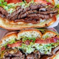Beef Torta · TACO BLANCO Angus beef tacos are cooked over mesquite flame!  Warm bolillo bread layered wit...