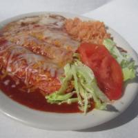 Enchiladas Vallarta · 3 fish, shrimp and crab enchiladas. Served with lettuce, tomato, guacamole and rice.